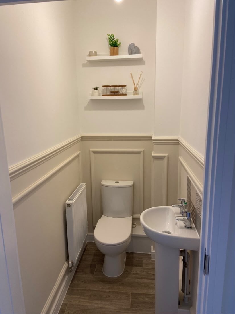 Bespoke cloakroom joinery with fitted wall panelling and shelving
