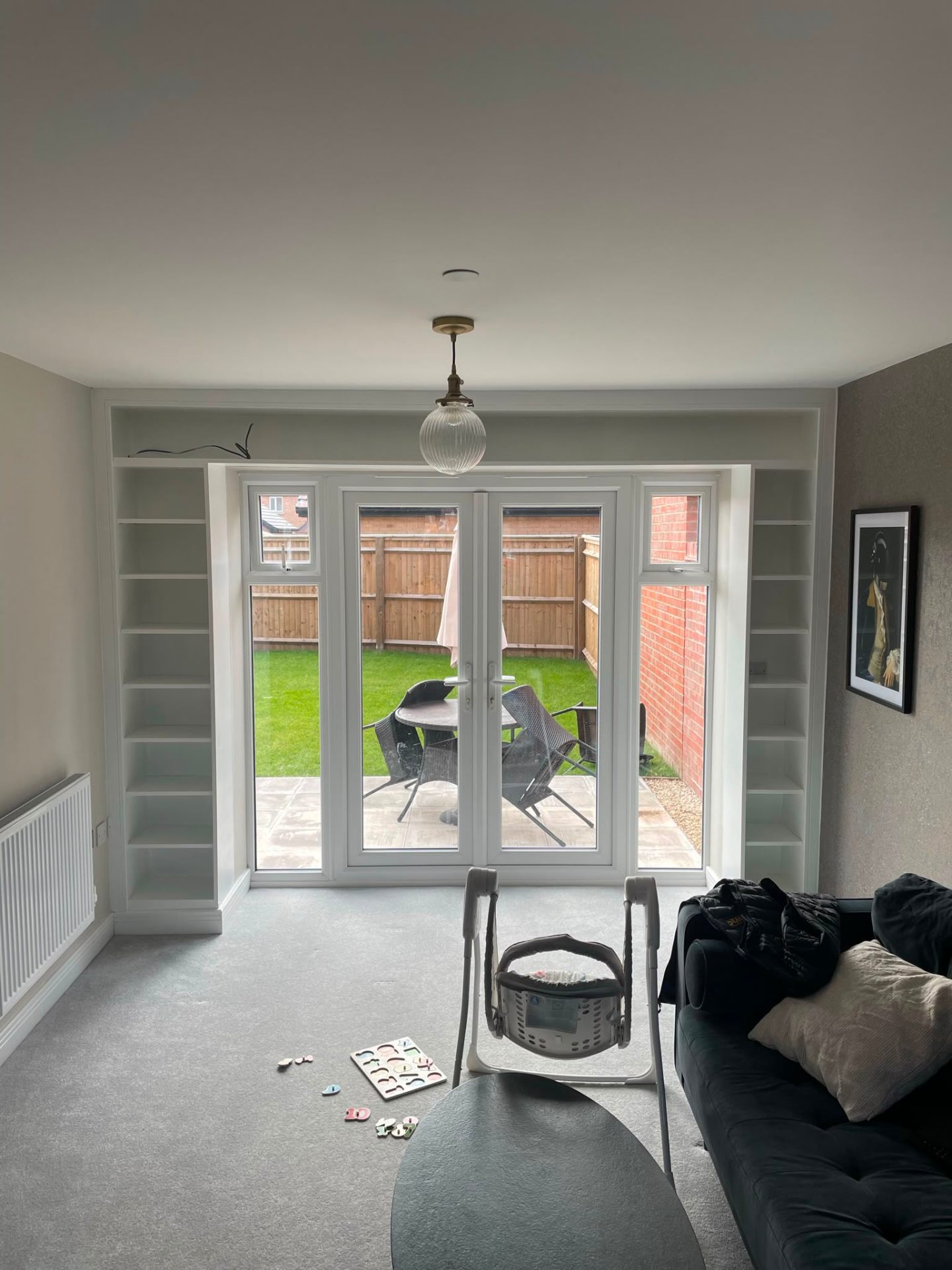 Extension with fitted alcove bookshelves and French doors