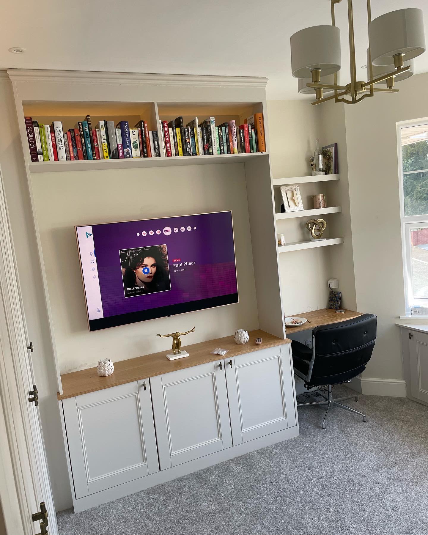 Alcove shelving and media unit joinery with integrated TV