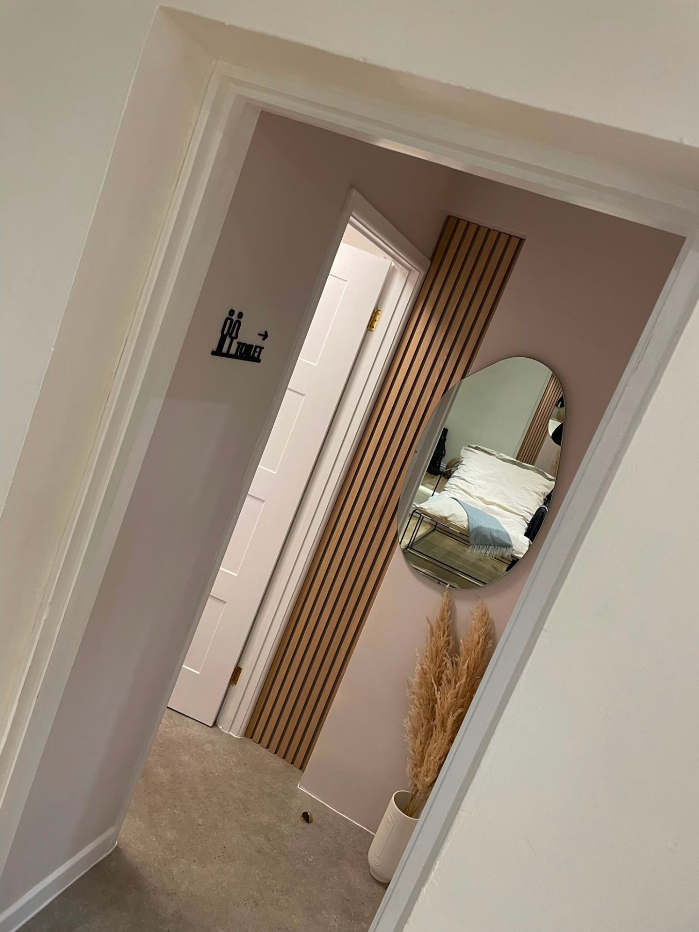 Panelled hallway with hung internal door, second fix carpentry