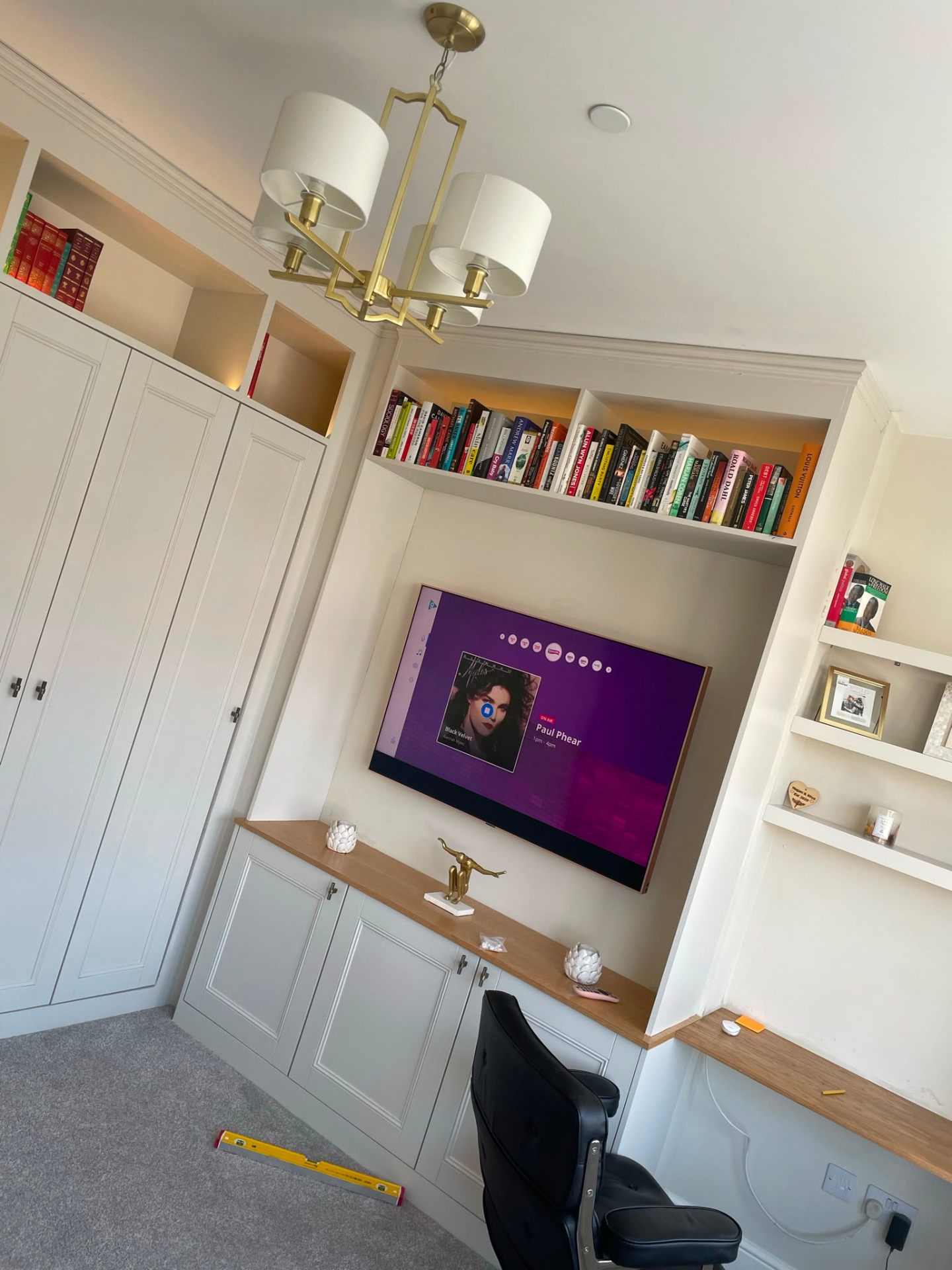 Bespoke fitted wardrobe and media unit with integrated TV