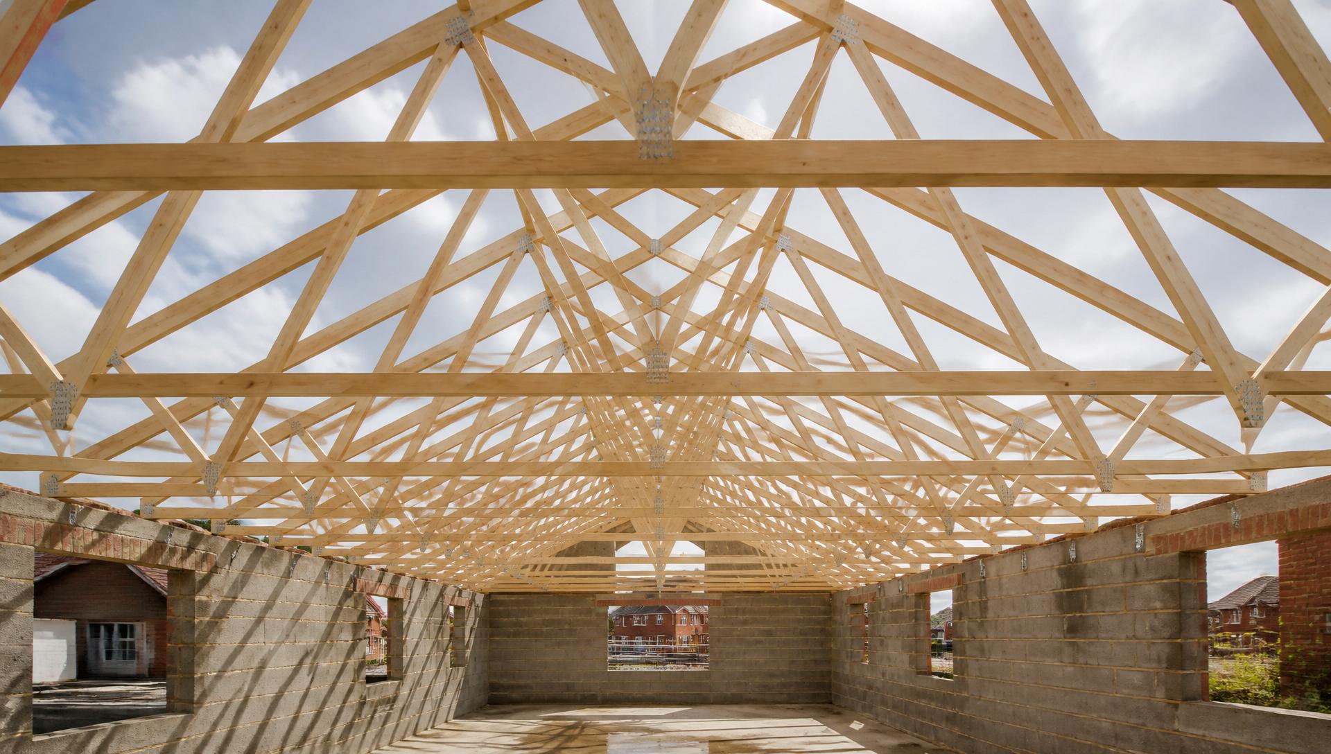 Prefabricated timber roof trusses installed on a new UK build